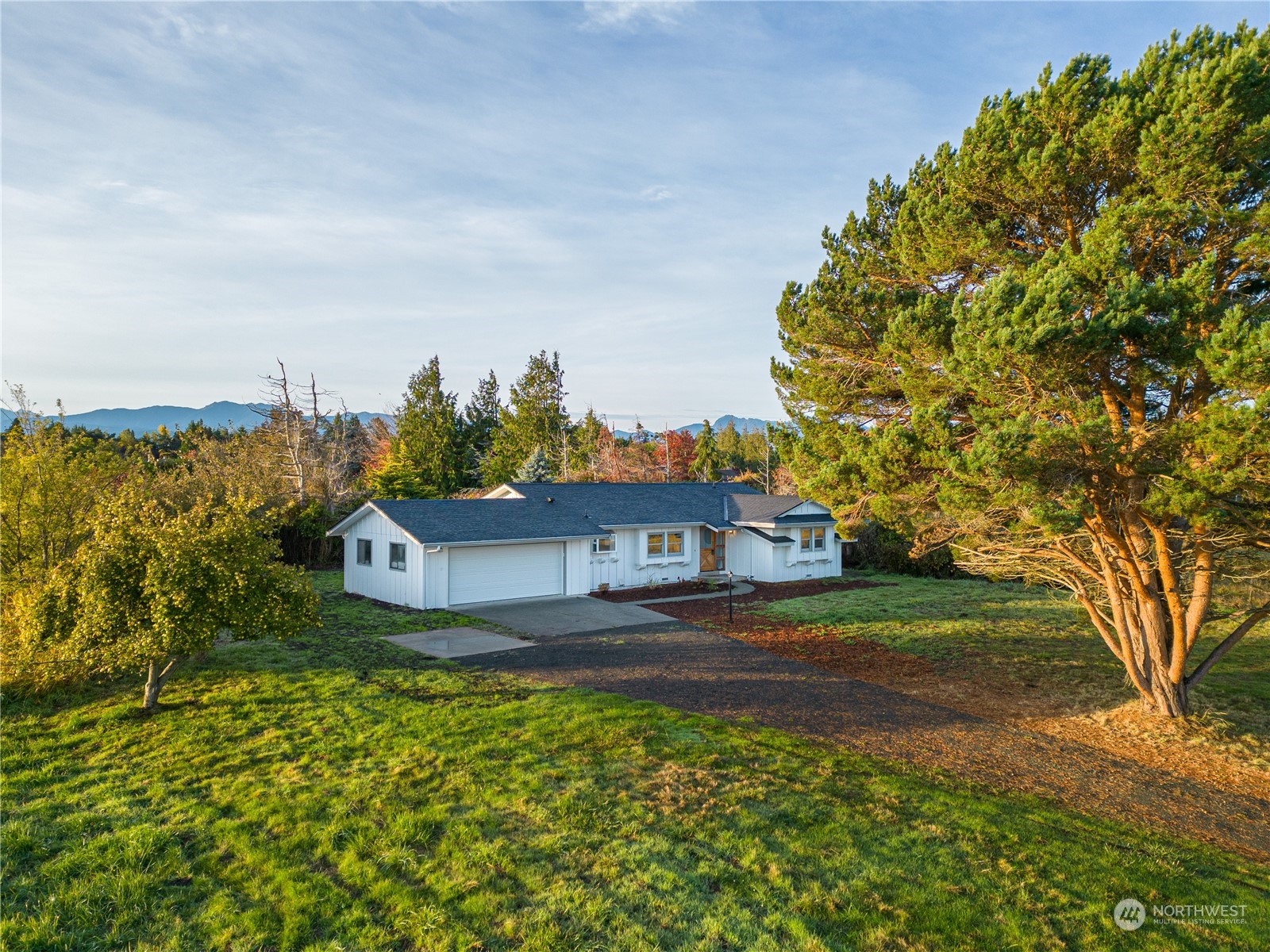 492 East Anderson Road Sequim, WA 98382 - Photo 2 of 33 a view of a house with a yard and lake view