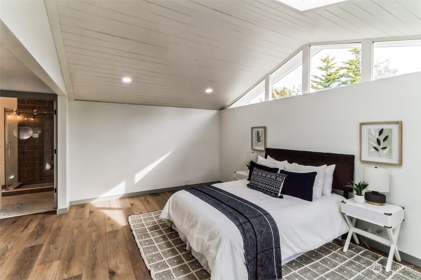 492 East Anderson Road Sequim, WA 98382 - Photo 23 of 33 a bedroom with a bed and wooden floor