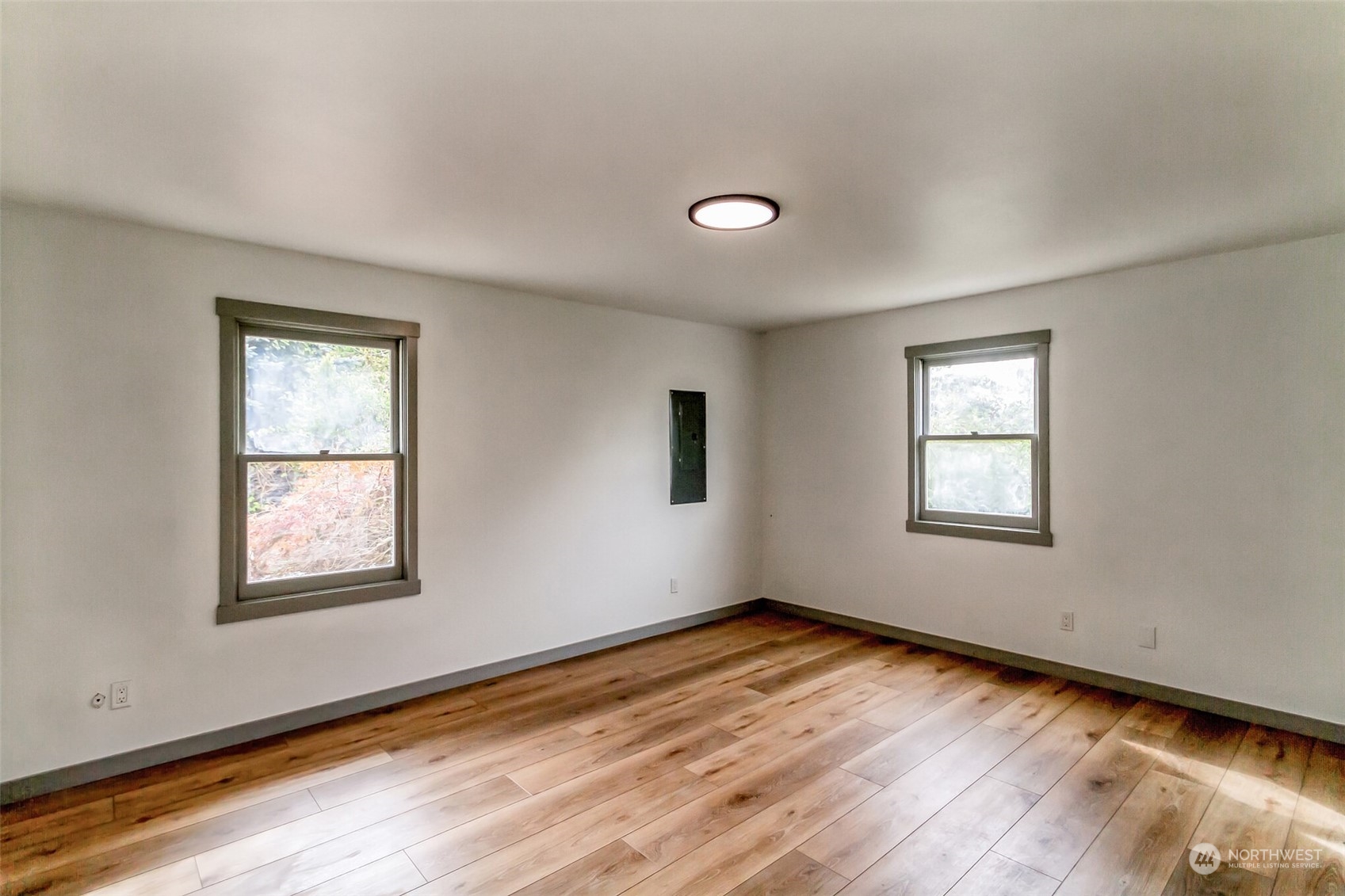 492 East Anderson Road Sequim, WA 98382 - Photo 29 of 33 a view of an empty room with wooden floor and a window