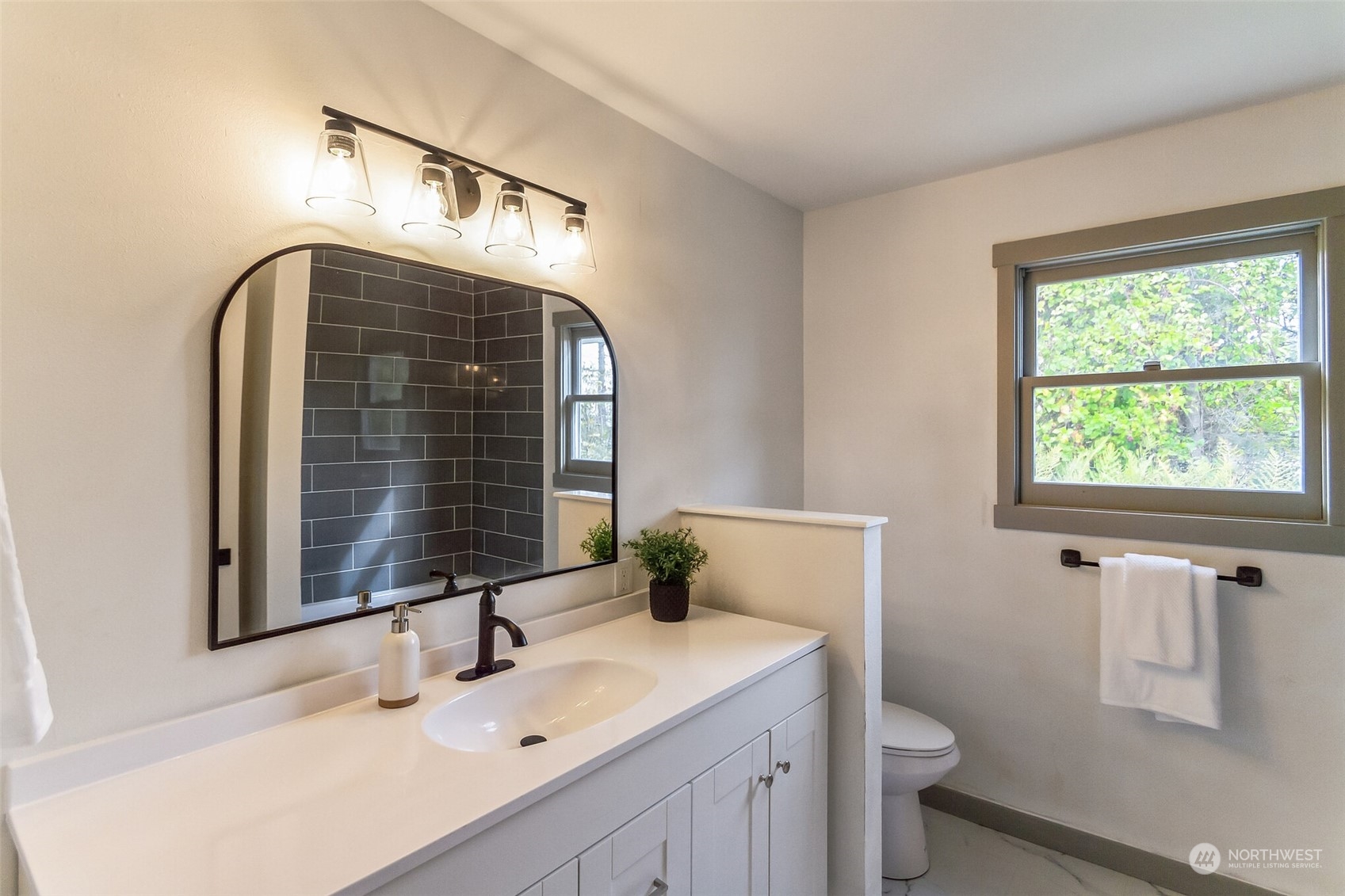 492 East Anderson Road Sequim, WA 98382 - Photo 32 of 33 a bathroom with a sink and a mirror