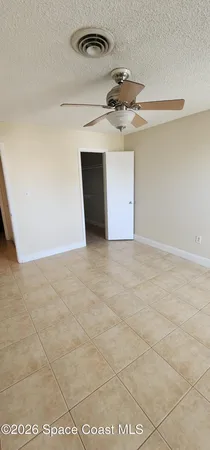 a room with a toilet a sink and mirror