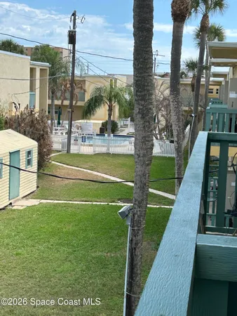 a view of a patio with a yard