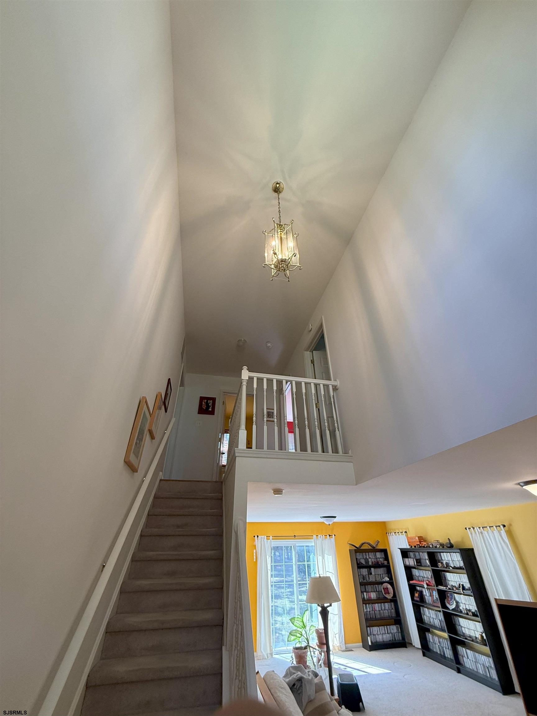 420 North Chew Road Hammonton, NJ 08037 - Photo 11 of 34 a view of a livingroom with wooden floor and a staircase