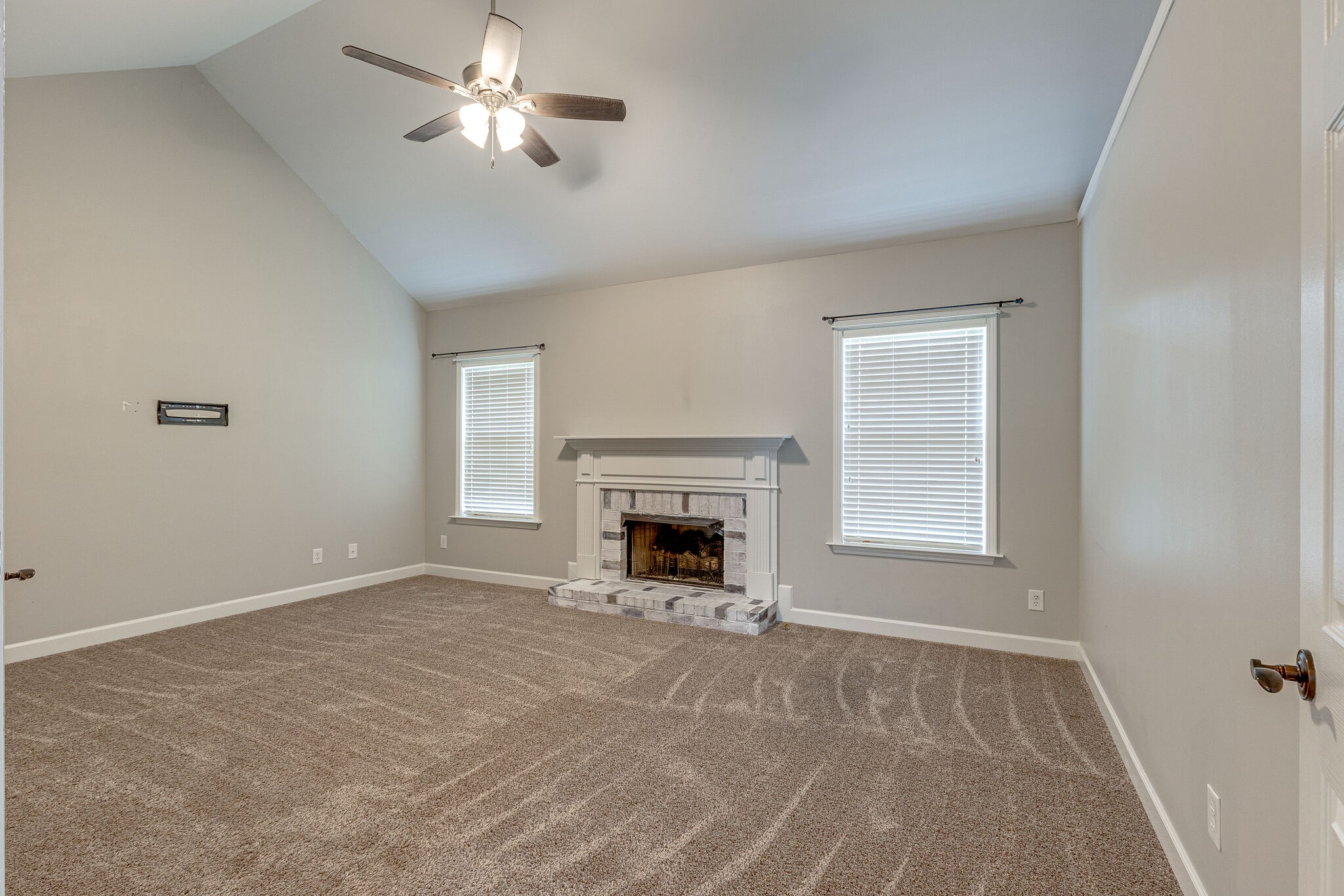 3021 Romain Trail Spring Hill, TN 37174 - Photo 13 of 18 a view of an empty room with a fireplace and a window