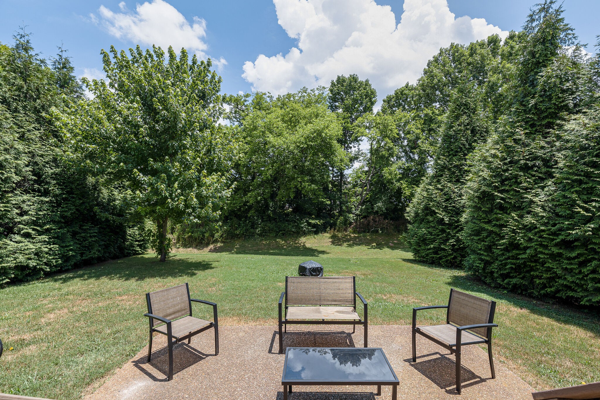 3021 Romain Trail Spring Hill, TN 37174 - Photo 17 of 18 a view of a bench in the garden near a lake