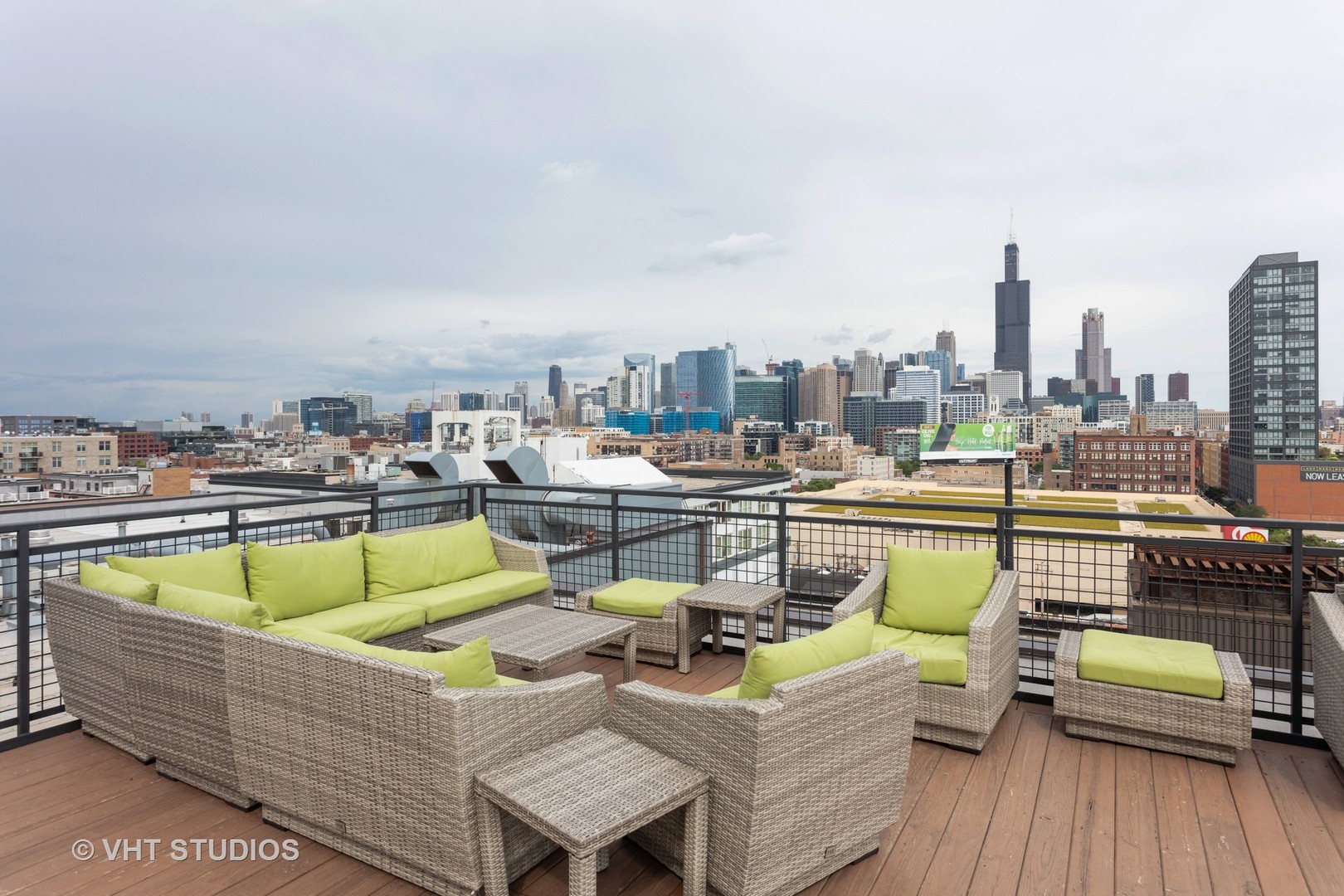 1224 West Van Buren Street, Unit 217 Chicago, IL 60607 - Photo 15 of 16 a view of a roof deck with couches and potted plants