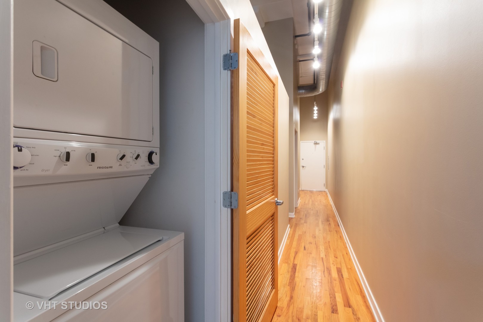 1224 West Van Buren Street, Unit 217 Chicago, IL 60607 - Photo 8 of 16 a bathroom with a sink and a mirror
