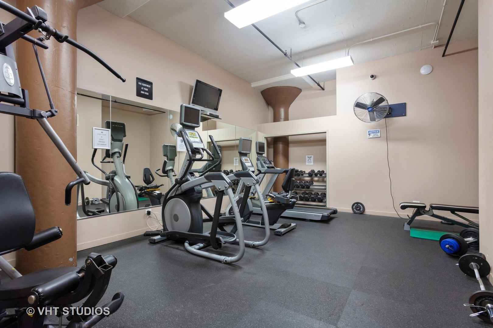 1224 West Van Buren Street, Unit 217 Chicago, IL 60607 - Photo 9 of 16 a view of a room with gym equipment