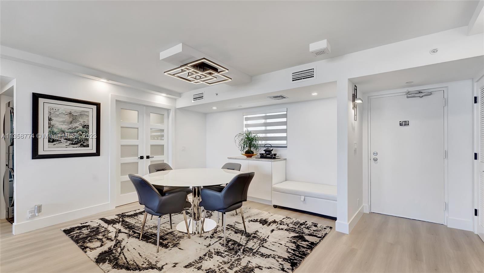 300 Ocean Trail Way, Unit 309 Jupiter, FL 33477 - Photo 11 of 36 a view of a dining room with furniture