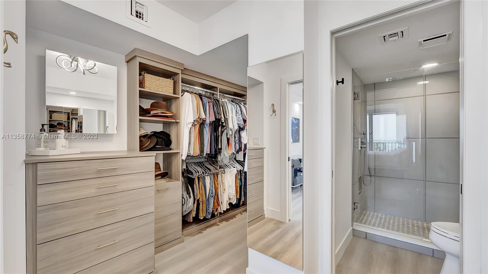 300 Ocean Trail Way, Unit 309 Jupiter, FL 33477 - Photo 19 of 36 a view of walk in closet with clothes and shoes