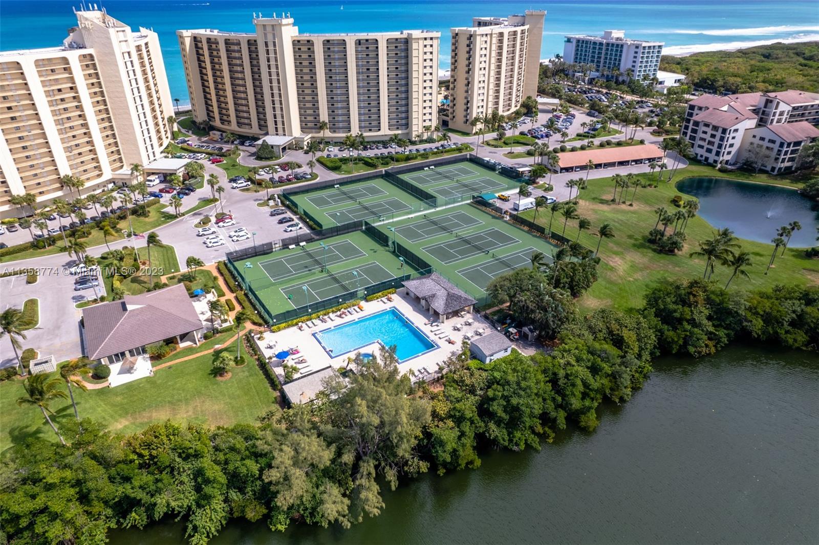 300 Ocean Trail Way, Unit 309 Jupiter, FL 33477 - Photo 29 of 36 an aerial view of a swimming pool with outdoor seating
