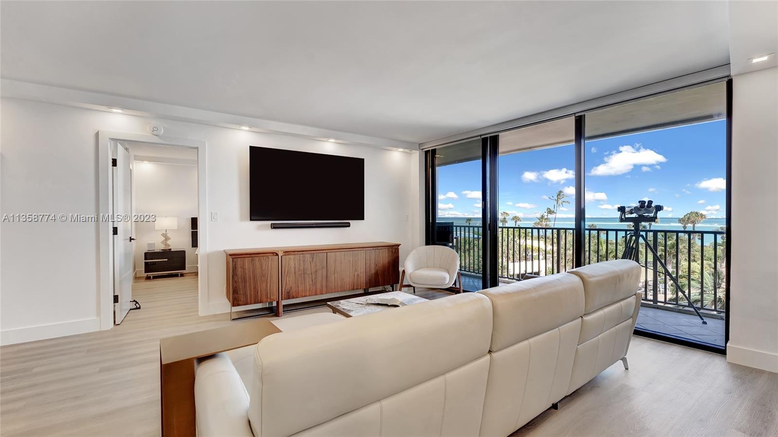 300 Ocean Trail Way, Unit 309 Jupiter, FL 33477 - Photo 3 of 36 a living room with furniture and a flat screen tv