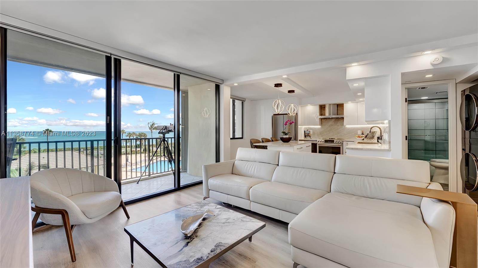 300 Ocean Trail Way, Unit 309 Jupiter, FL 33477 - Photo 10 of 36 a living room with furniture and a large window