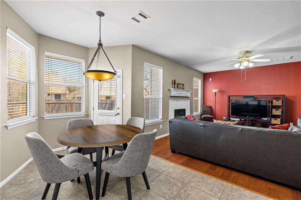 3508 Bratton Ridge Crossing Austin, TX 78728 - Photo 4 of 18 A well-lit casual dining area seamlessly connects to the inviting living space, offering both comfort and functionality.