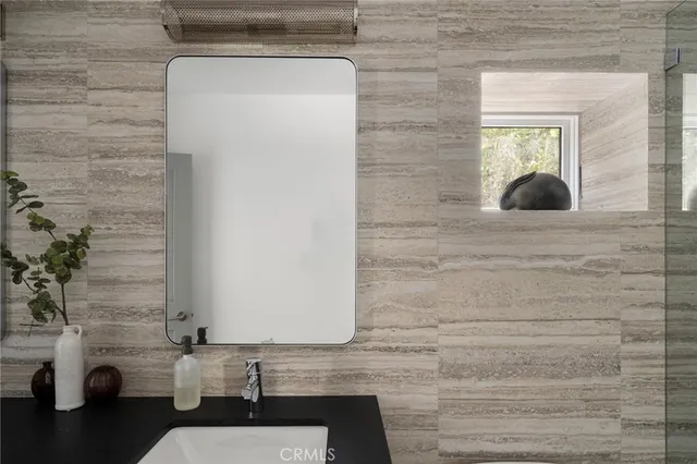a bathroom with a sink and a mirror
