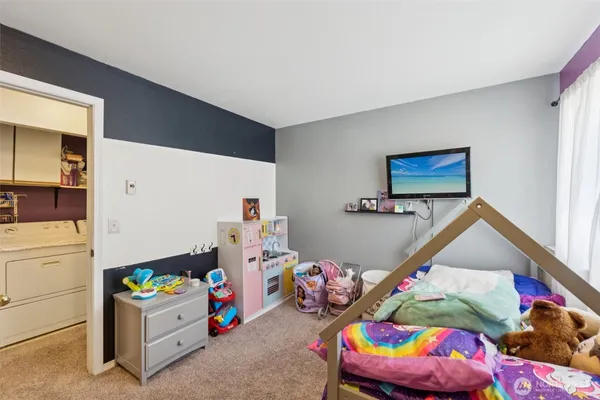 a bedroom with a bed and closet