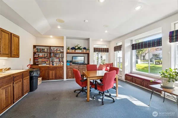 a dining room with furniture and window
