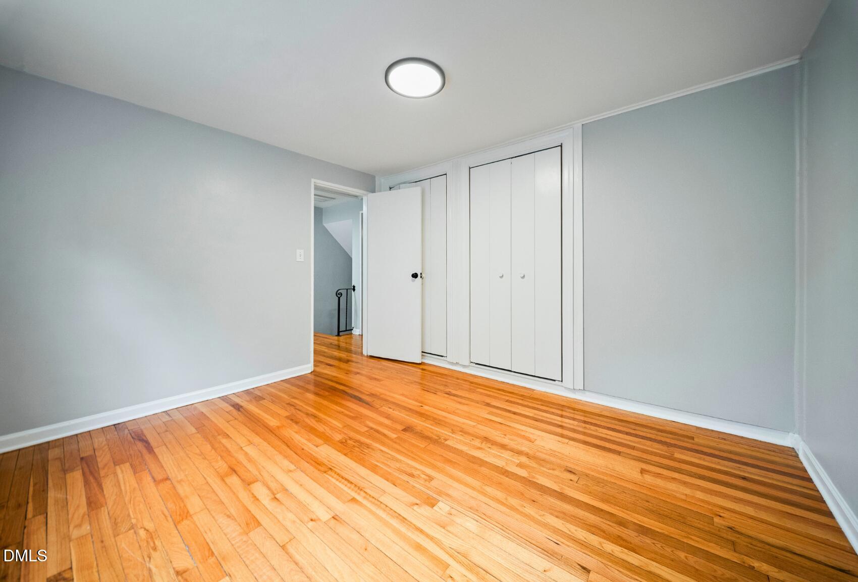 967 St Marys Street Raleigh, NC 27605 - Photo 27 of 34 a view of empty room with wooden floor