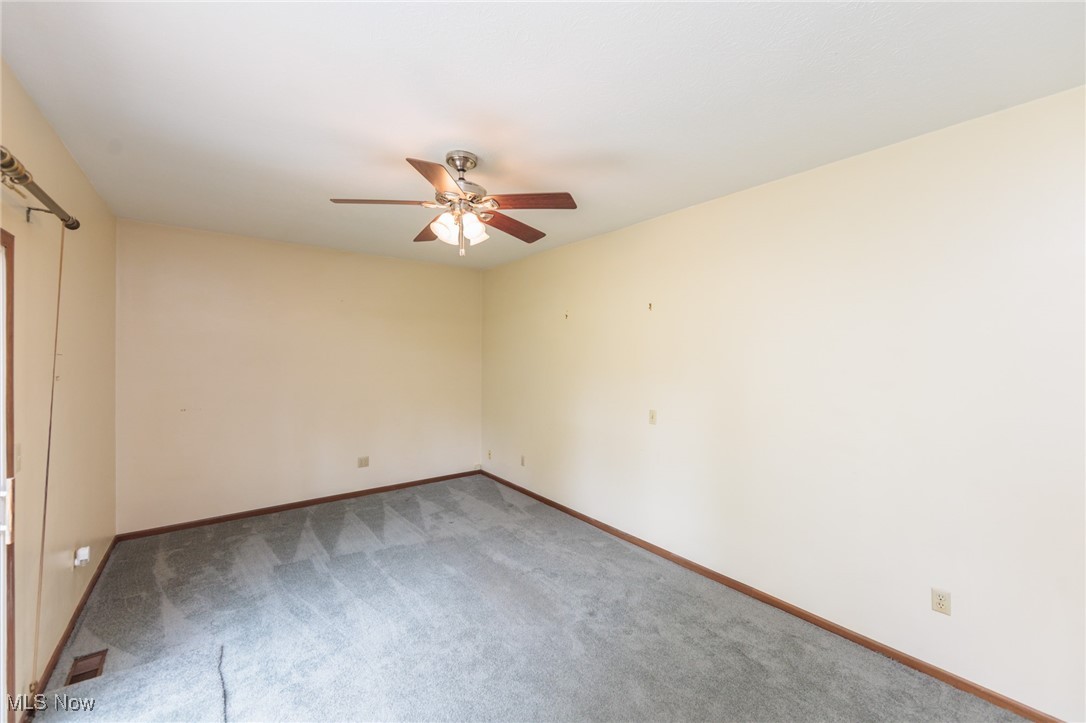 3324 Marsh Road Stow, OH 44224 - Photo 19 of 33 Carpeted empty room featuring ceiling fan and baseboards