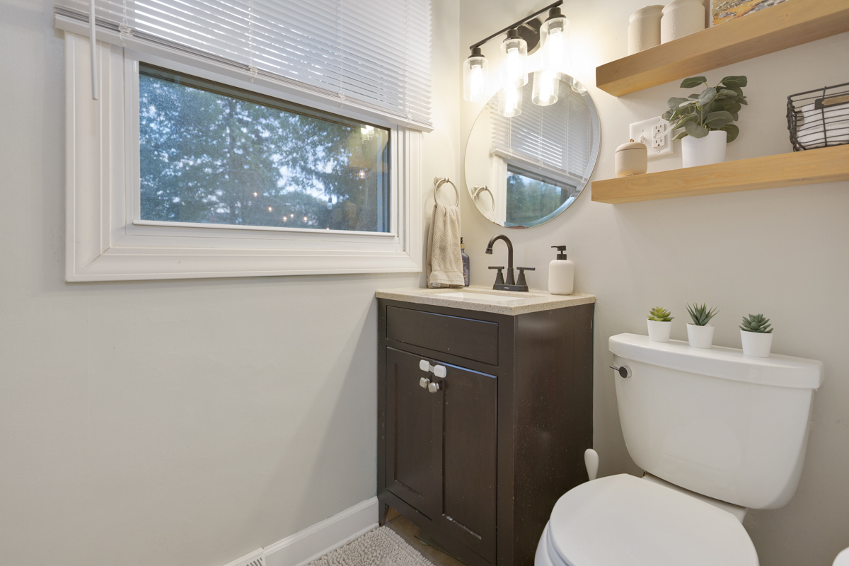 328 South 14th Street St. Charles, IL 60174 - Photo 13 of 26 a bathroom with a toilet sink and mirror