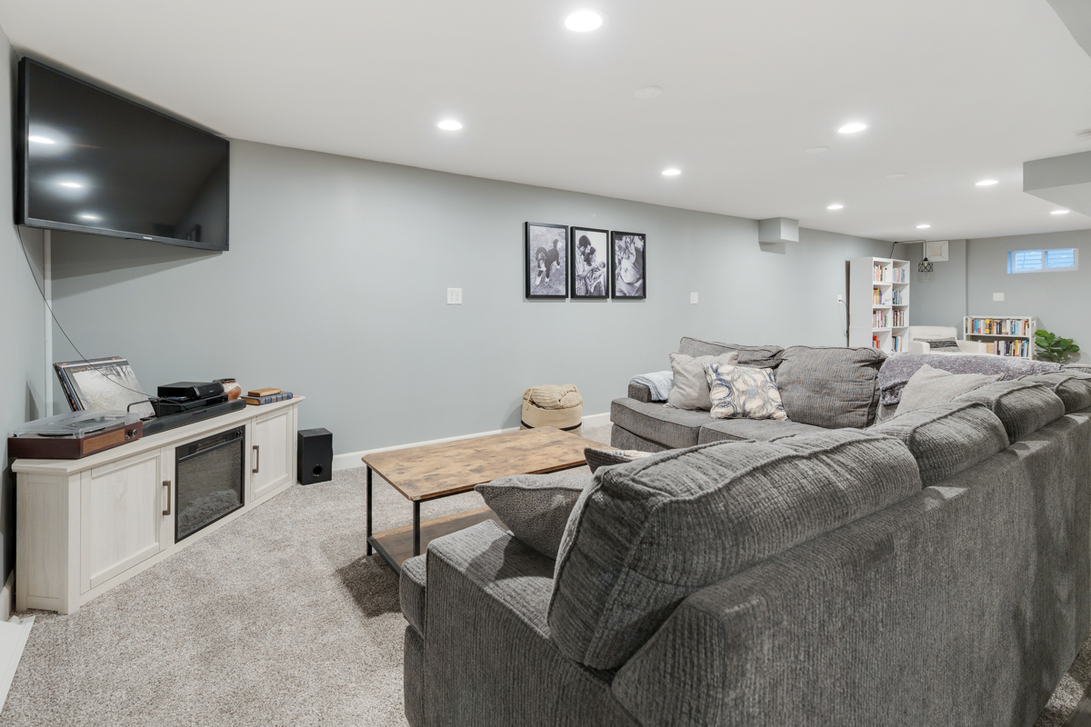 328 South 14th Street St. Charles, IL 60174 - Photo 16 of 26 a living room with furniture and a flat screen tv