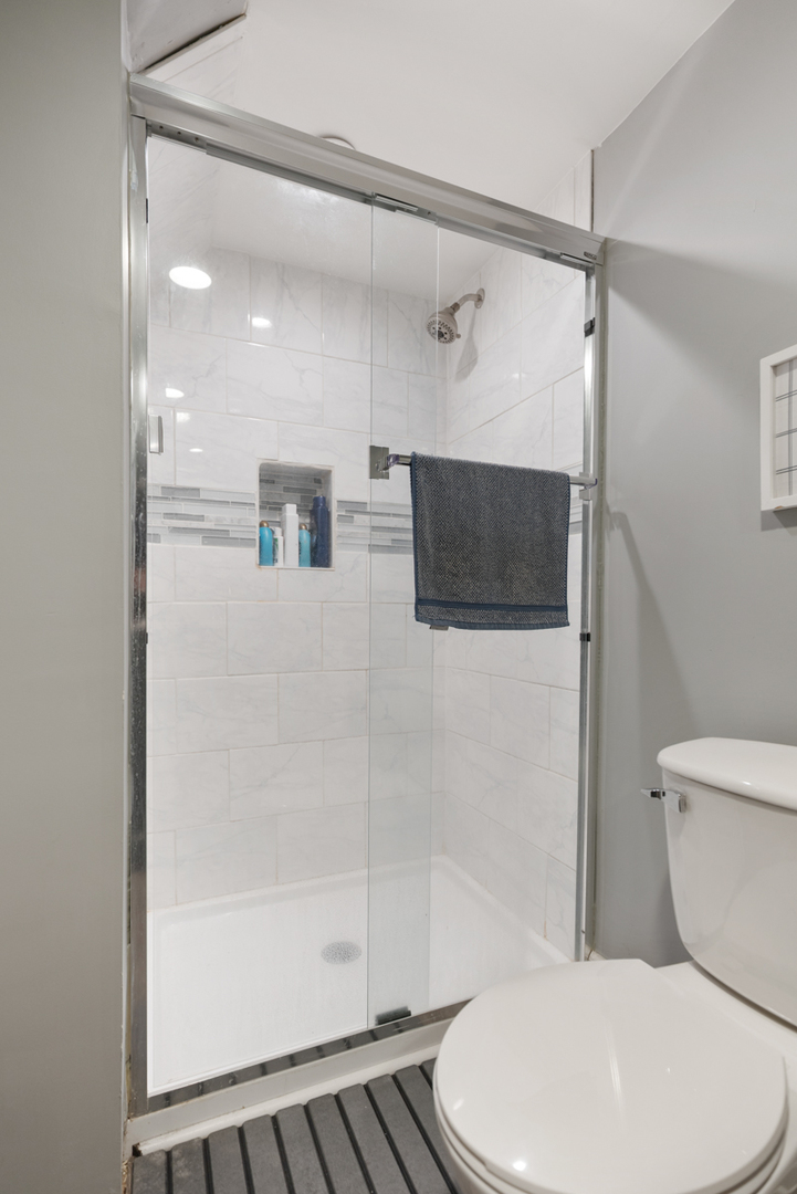 328 South 14th Street St. Charles, IL 60174 - Photo 21 of 26 a white toilet sitting next to a bathroom sink