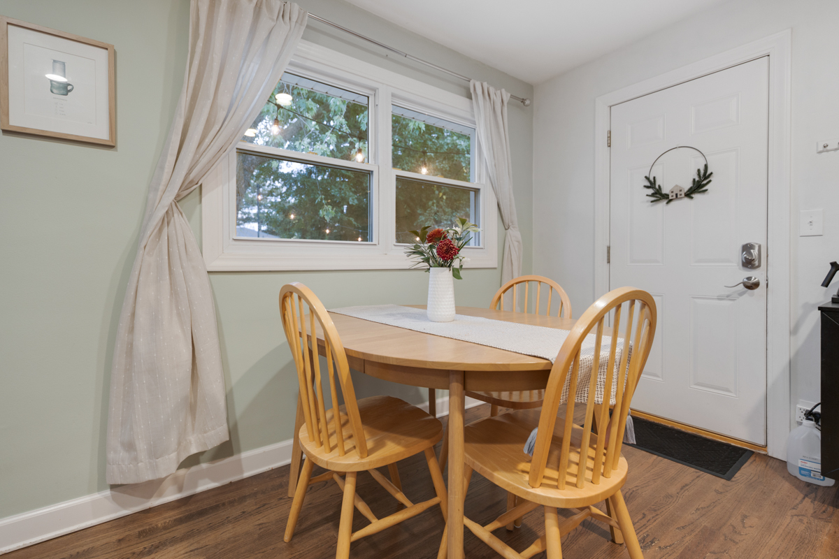 328 South 14th Street St. Charles, IL 60174 - Photo 8 of 26 a dining room with furniture a window and wooden floor