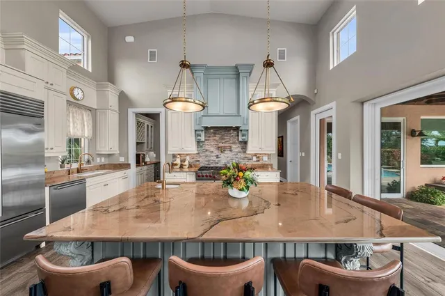 a bedroom with a bed potted plant with the outer view