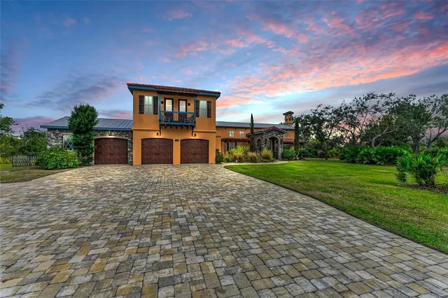 a outdoor space with lots of green space and glass windows
