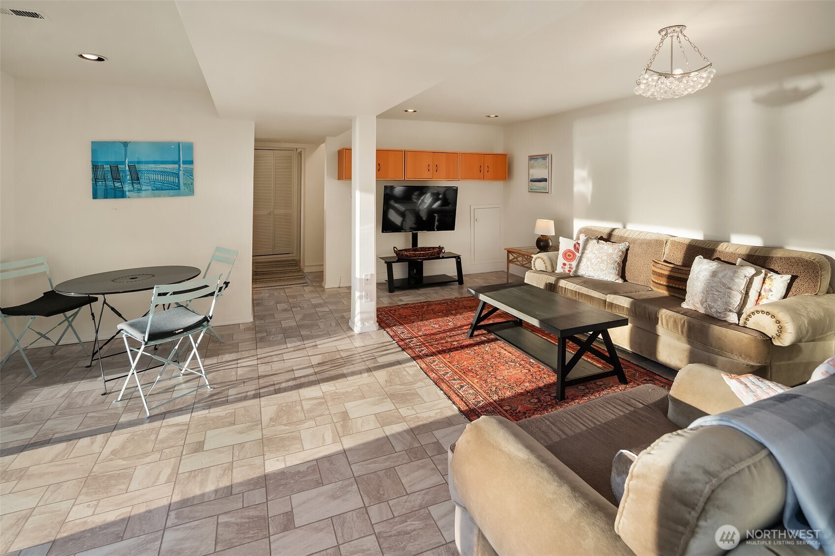 6790 Sills Road Clinton, WA 98236 - Photo 25 of 40 a living room with furniture and a flat screen tv