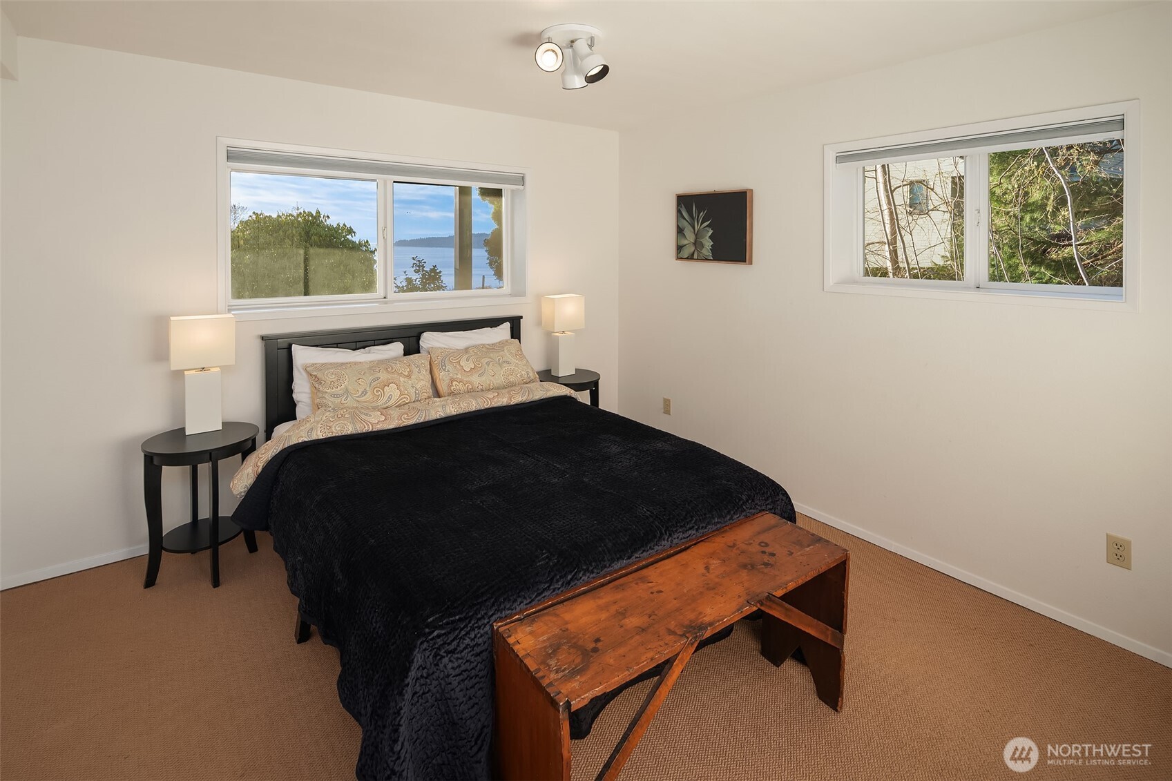 6790 Sills Road Clinton, WA 98236 - Photo 27 of 40 a bedroom with a bed and window