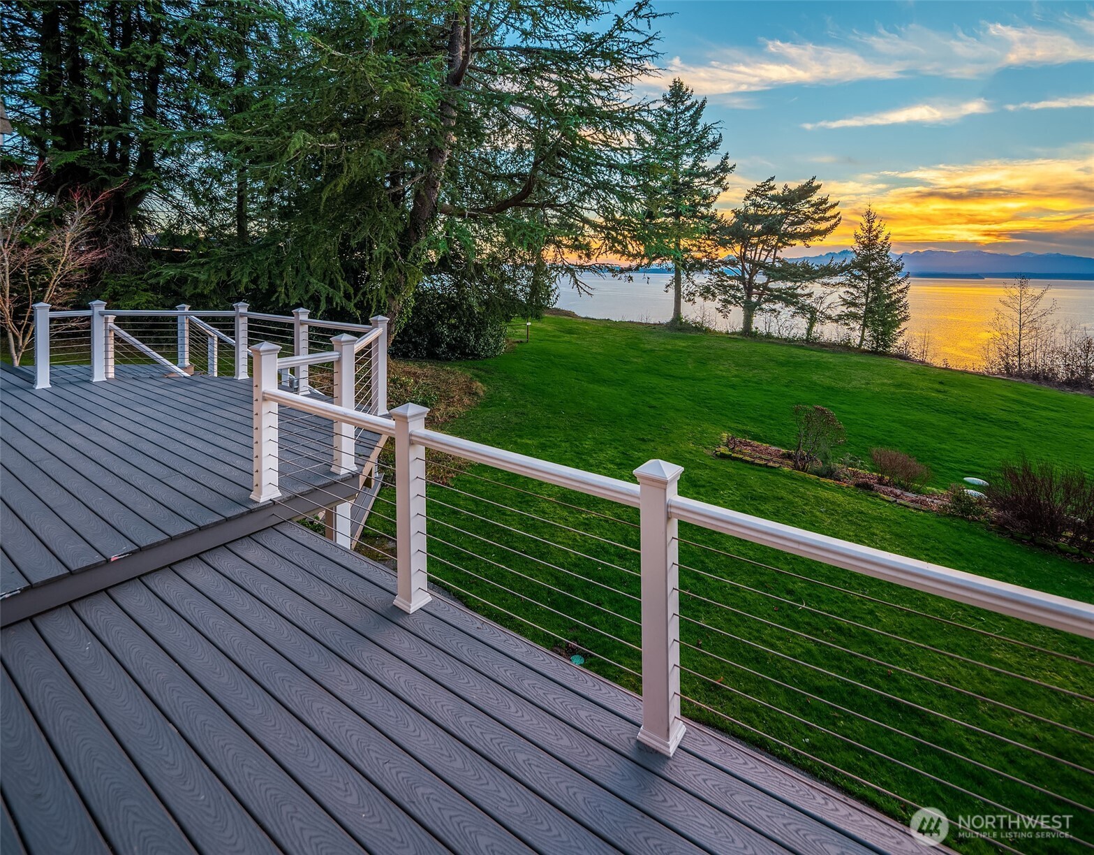 6790 Sills Road Clinton, WA 98236 - Photo 6 of 40 a view of a wooden deck with a yard