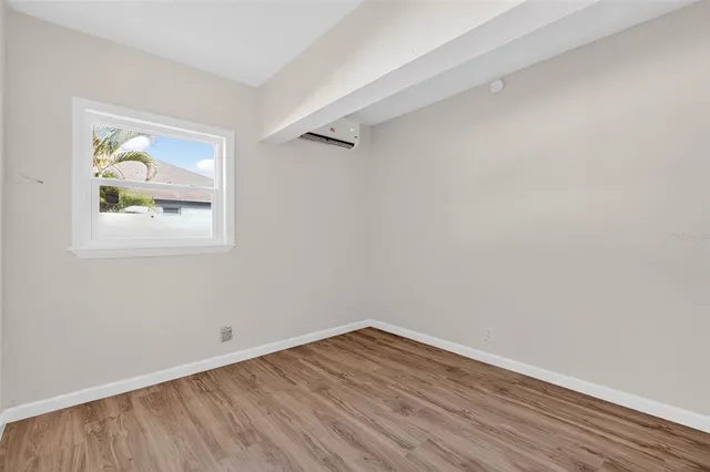 a kitchen with granite countertop white cabinets and a stove