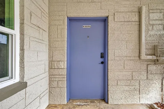 a view of empty room with wooden floor and ceiling fan