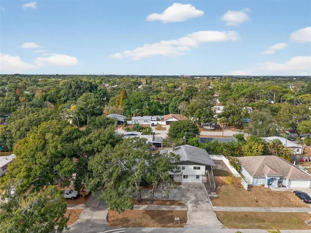 an aerial view of residential building and trees