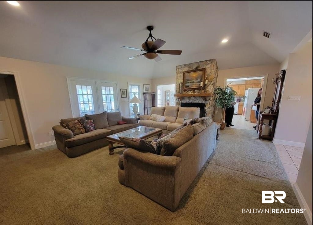 16311 Old Brady Road Bay Minette, AL 36507 - Photo 4 of 38 Living area featuring a stone fireplace with a wood mantel, vaulted ceiling, and recessed lighting
