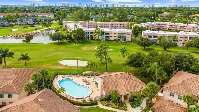 an aerial view of a house with swimming pool and outdoor space