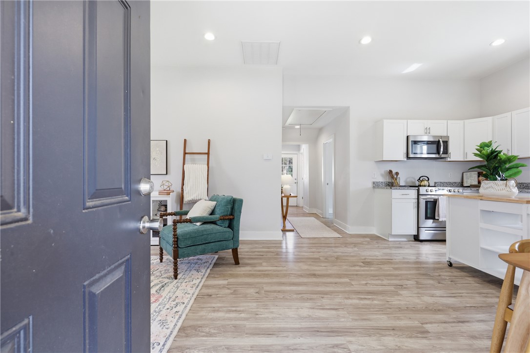 1 Brock Street Pelzer, SC 29669 - Photo 3 of 25 Step inside this inviting open-concept living space, blending comfort with a functional kitchen layout.