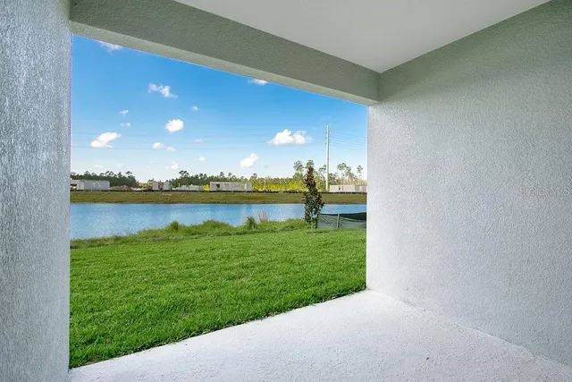a backyard of a house with lots of green space