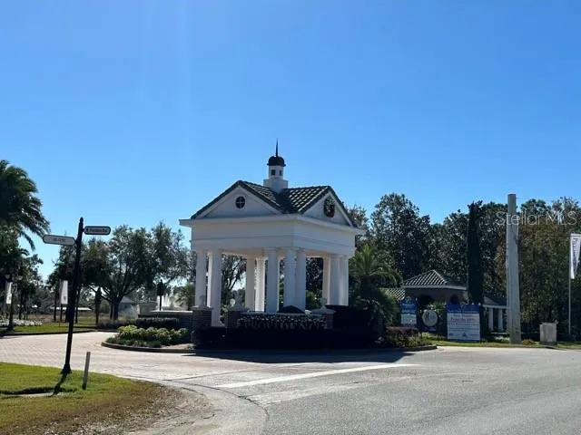 an aerial view of a house with a lake view
