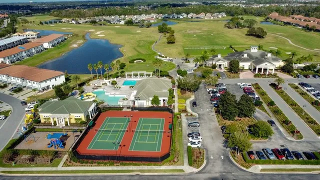 an aerial view of a house with garden space and street view