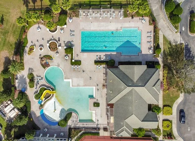 an aerial view of a houses with a yard