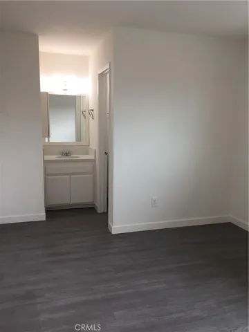 a view of cabinets and wooden floor