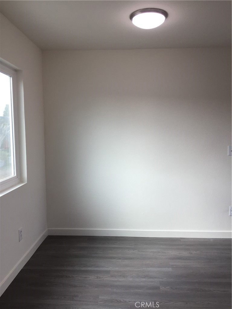 17011 Sims Lane, Unit 6 Huntington Beach, CA 92649 - Photo 4 of 19 a view of an empty room and window