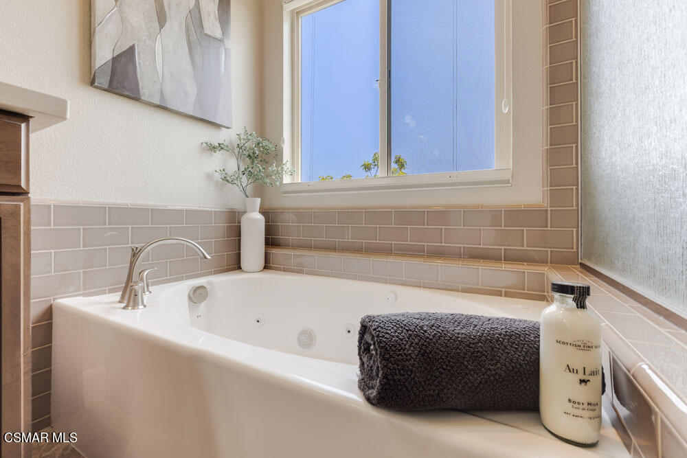 13988 Burdock Drive Moorpark, CA 93021 - Photo 24 of 35 a bathroom with a bathtub and a sink