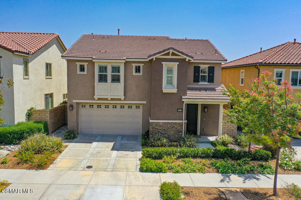 13988 Burdock Drive Moorpark, CA 93021 - Photo 30 of 35 a front view of a house with a garden