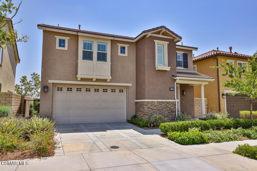 13988 Burdock Drive Moorpark, CA 93021 - Photo 3 of 35 a front view of a house with garden