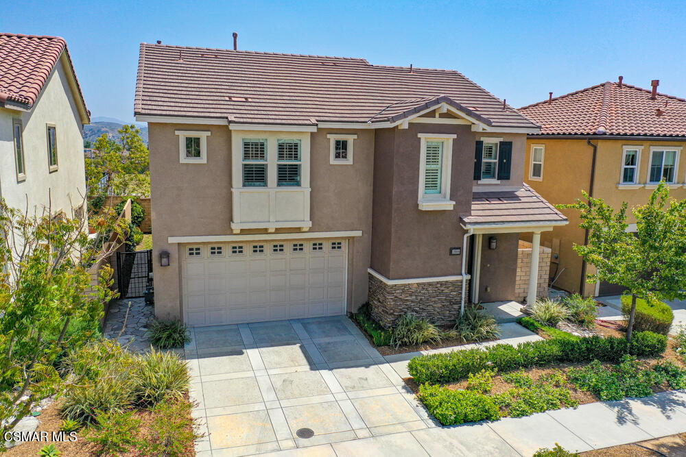 13988 Burdock Drive Moorpark, CA 93021 - Photo 32 of 35 a front view of a house with a garden