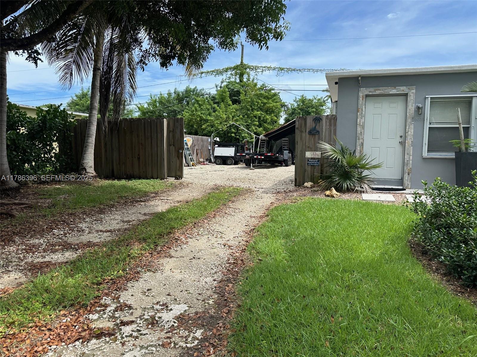 29035 Maine Road Homestead, FL 33033 - Photo 18 of 55 a front view of a house with a yard and tree