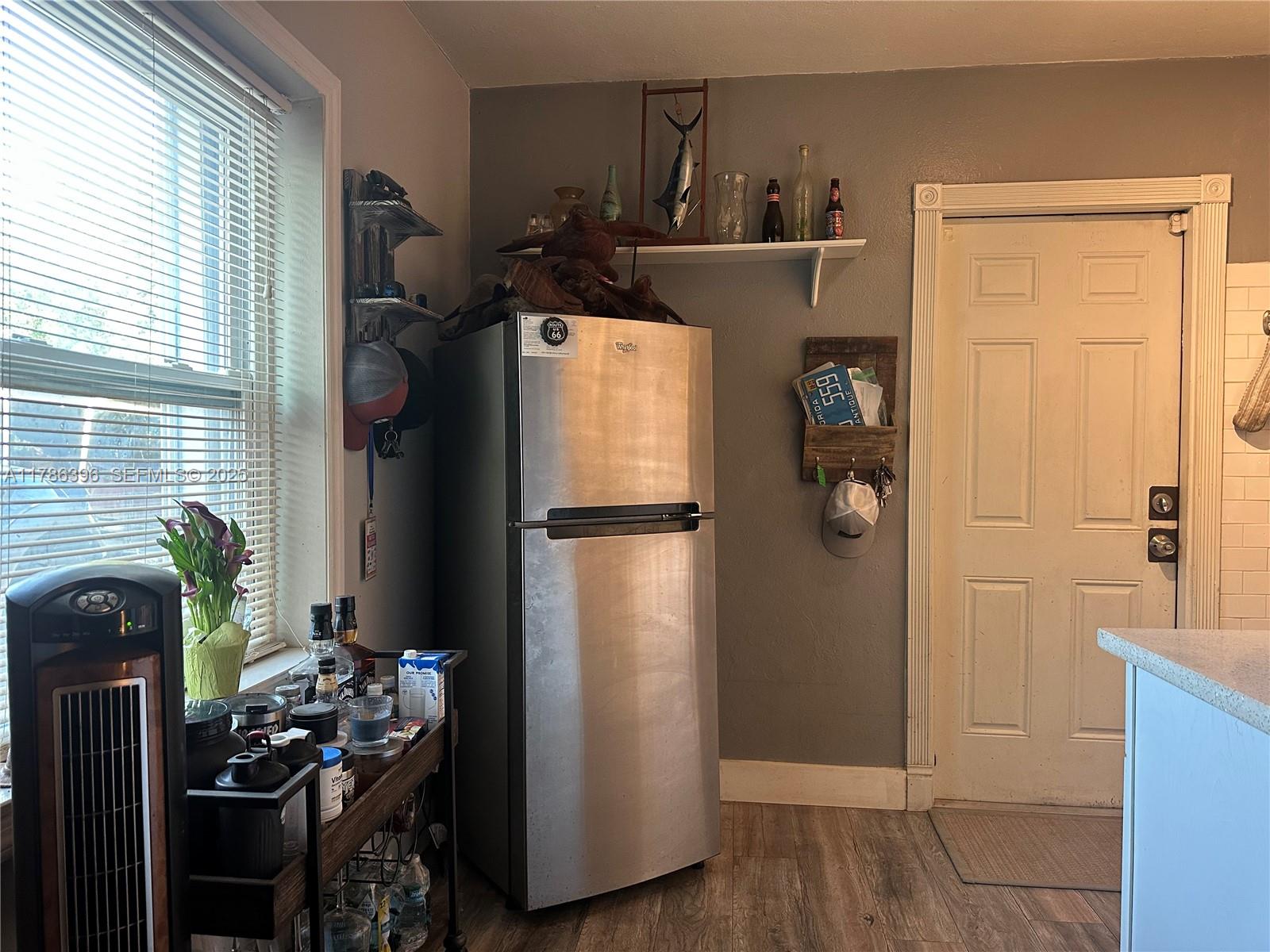 29035 Maine Road Homestead, FL 33033 - Photo 26 of 55 a kitchen with a refrigerator and a stove